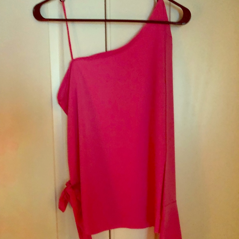 Hot pink one shoulder blouse.